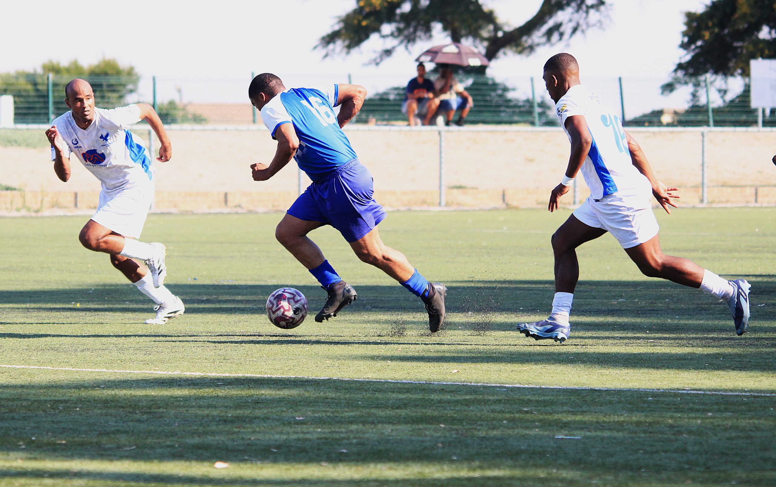 Clement Fortuin of Jomo's Power AFC cutting through Premier United defence in a SAFA Cape Town Hollywoodbets Mens Regional match at robinvale Sportsground
